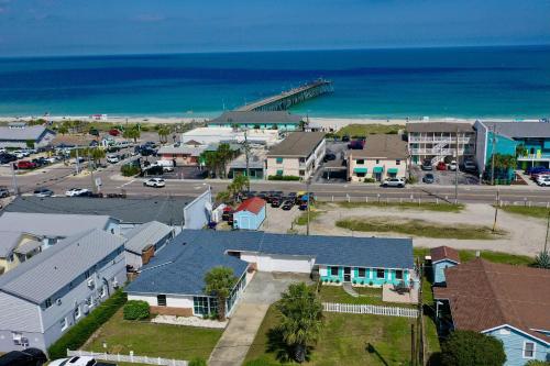 an aerial view of a small town with a beach at Lorraine's Beach Cottage in Kure Beach
