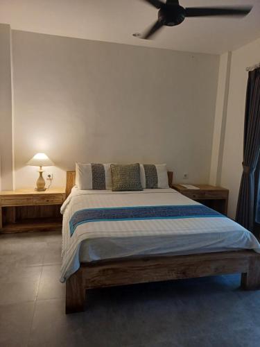 En eller flere senge i et værelse på Blu Mango