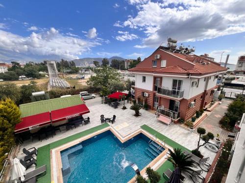 an aerial view of a house with a swimming pool at kerim apart tatil evleri in Fethiye