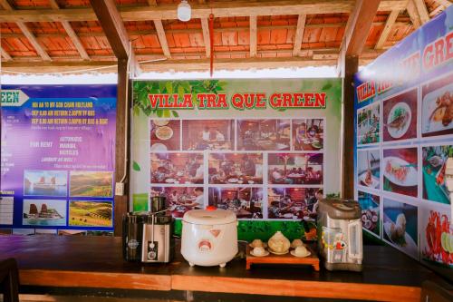 a restaurant with a sign that reads water fire up green at Tra Que Green Villa Hoi An in Hoi An