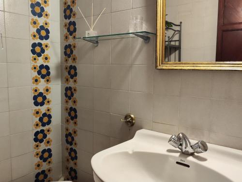 a bathroom with a sink and a mirror at Casa Castelló d'Empúries, 4 dormitorios, 8 personas - ES-228-96 in Castelló d'Empúries