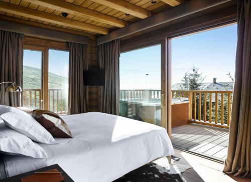 Posteľ alebo postele v izbe v ubytovaní El Lodge, Ski & Spa
