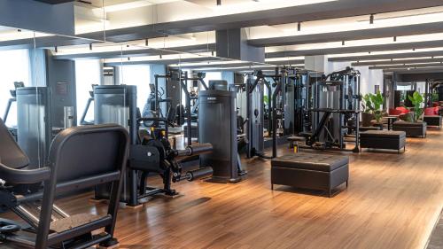 a gym with a lot of treadmills and machines at Shinagawa Prince Hotel East Tower in Tokyo