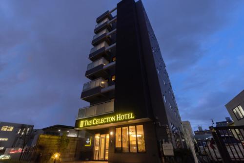 a building with a sign that reads the criterion hotel at THE CELECTON Higashiosaka Nagataekimae in Higashi-osaka