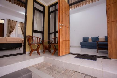 a living room with a couch and a table at Fresh Inn in Probolinggo