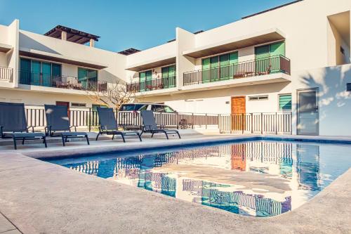 a swimming pool in front of a building at Casa Coral in La Paz