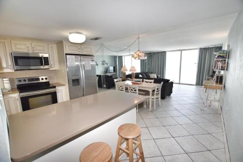 a kitchen and living room with a kitchen and a living room at 1412 Waters Edge Resort condo in Myrtle Beach