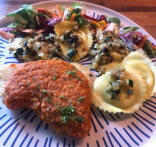a plate of food with fish and a salad at Appartement T3 Aux Deux Cigognes Gries in Gries