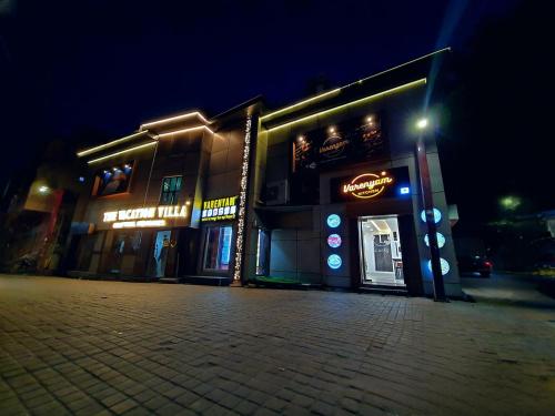 a store on a street at night at The Vacation Villa in Agra