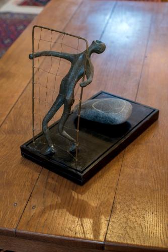 a bronze statue of a person on a table at Camera et Caetera Chambres d'hôtes B&B in Roubaix