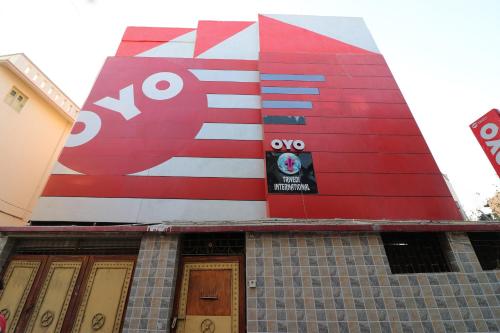 a building with a sign on the side of it at OYO Ruby Park Trivedi International Near Acropolis Mall in Kolkata
