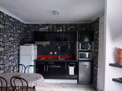 Dapur atau dapur kecil di WELCOME ARROMANCHES