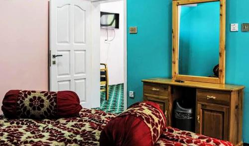 Ένα ή περισσότερα κρεβάτια σε δωμάτιο στο HUNZA Mountain HOTEL