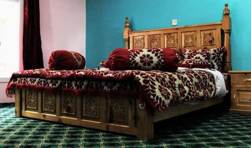 Ένα ή περισσότερα κρεβάτια σε δωμάτιο στο HUNZA Mountain HOTEL