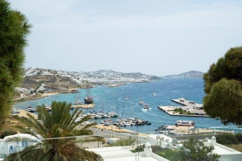 a view of a harbor with boats in the water at Rhenia Hotel in Tourlos