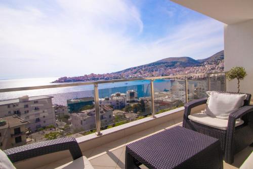 a balcony with a view of the water at Modern Central Seaview Apartment Saranda in Sarandë