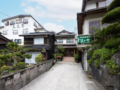 a street in front of a house at Yodoya in Toyooka