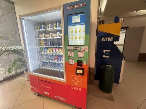 a soda vending machine in a building at 2BR, 1 Car Park, 4Pax Seaview 118IslandPlaza in Tanjong Tokong