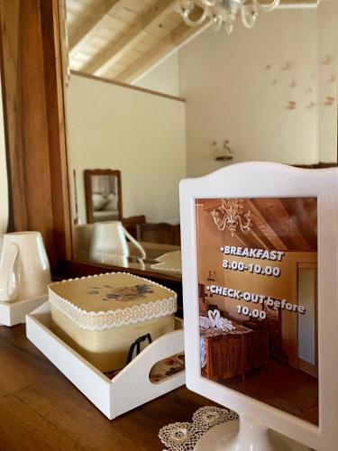 a cake sitting on top of a table in a room at ROSETO HOLIDAYS AZZURRO in Cavalcaselle