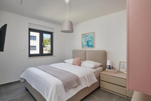 Llit o llits en una habitació de Irena Apartment No 2