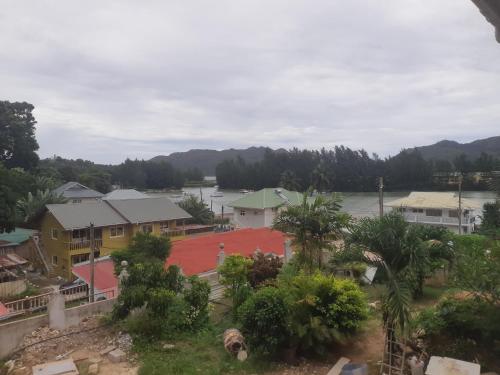 a view of a resort with a red basketball court at La Residence D'Almee Guesthouse in Anse Possession