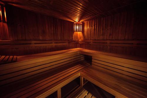 a large wooden sauna with wooden floors and wooden walls at Hotel Kaštieľ Mojmírovce in Mojmírovce