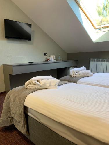 Arta City Hotelにあるベッド