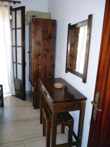 a room with a wooden table and a door at Villa Helen in Arillas