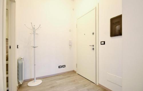 a white room with a display on the wall at Beautiful Apartment In Santa Margherita in Santa Margherita Ligure