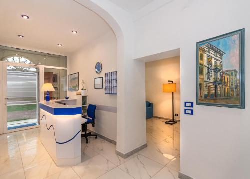a room with a counter and a desk in it at Hotel Rex in Viareggio