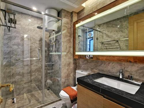 a bathroom with a sink and a shower at Yussy Homestay at R&F Princess Cove in Johor Bahru