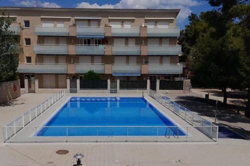 a large swimming pool in front of a building at UMA luna al sol Benicarlo-Peñiscola in Benicarló