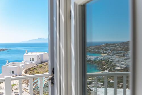 a view of the ocean from a room with a window at Villa Thelgo Mykonos in Psarou
