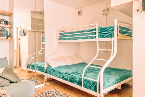 Postel nebo postele na pokoji v ubytování Lido Spina - Grazioso monolocale con Piscina