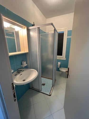 a bathroom with a shower and a sink at Villaggio Michelangelo Lotto M1 in Bibione