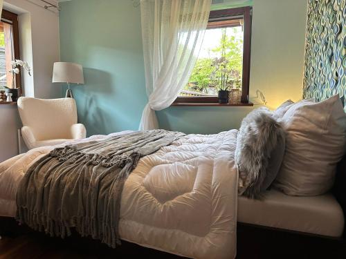 Posteľ alebo postele v izbe v ubytovaní APARTAMENT "NA MOCARNI"