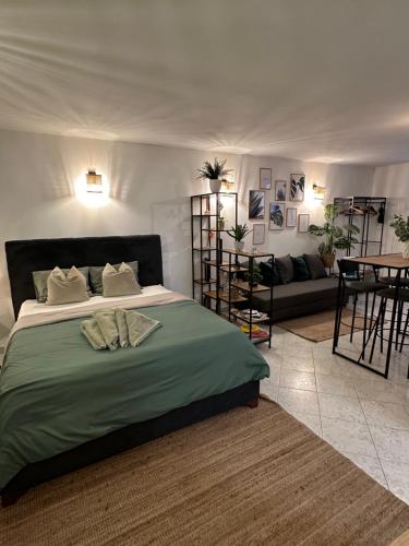 a bedroom with a large bed and a living room at Apartment Avareén Verde Old-town 150m to the Sea in Rovinj
