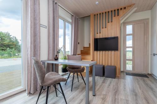 Μια τηλεόραση ή/και κέντρο ψυχαγωγίας στο Atostogų namelis prie jūros