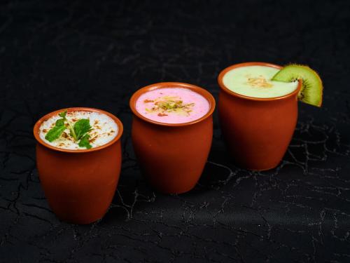 a group of three cups filled with a drink at Sayaji Pune in Pune