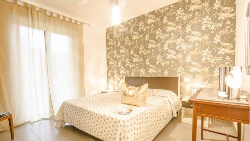 En eller flere senge i et værelse på Myconos Deluxe D3 - Pineto Vacanza