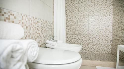 a bathroom with a toilet and a sink at BeB Villa Pacifica in Peschici