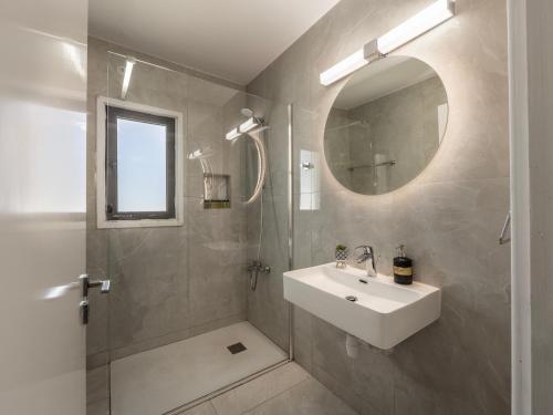 a bathroom with a sink and a mirror at Villa Socrates in Protaras