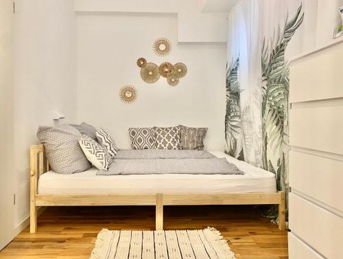 a room with a bed with pillows on it at Ferienwohnung Seesprung am Bodensee in Gaienhofen