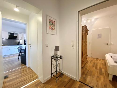 a view of a living room and kitchen from the hallway at Ferienwohnung Seesprung am Bodensee in Gaienhofen