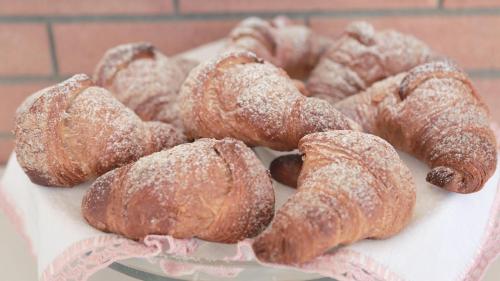 a plate of pastries and donuts on a table at BeB Villa Pacifica in Peschici