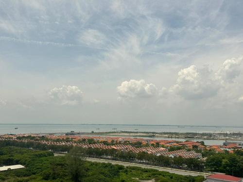 a view of a city and the water with buildings at 2BR, 1 Car Park, 4Pax Seaview 118IslandPlaza in Tanjong Tokong