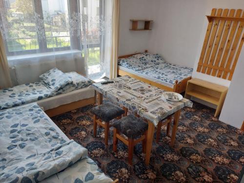 Ένα ή περισσότερα κρεβάτια σε δωμάτιο στο Pokoje Gościnne Viking