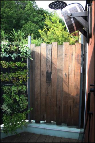 a wooden fence in front of a house at Casa Vacanze Borc dai Cucs in Faedis