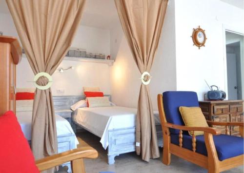 A bed or beds in a room at RNET - RHC 3603 Roses Holiday Center