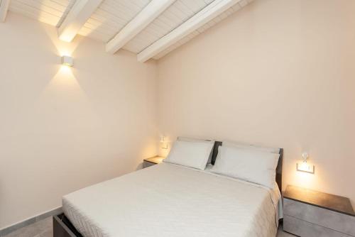 Postel nebo postele na pokoji v ubytování B&B Il Glicine